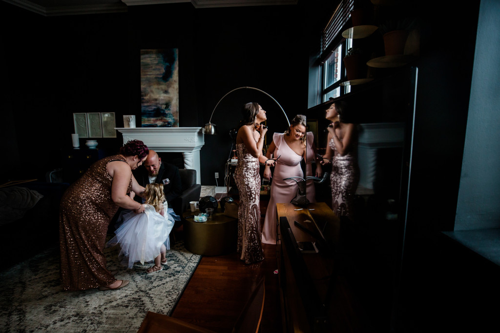 Bridesmaids getting ready in room 602 of Loft 310 on a wedding morning