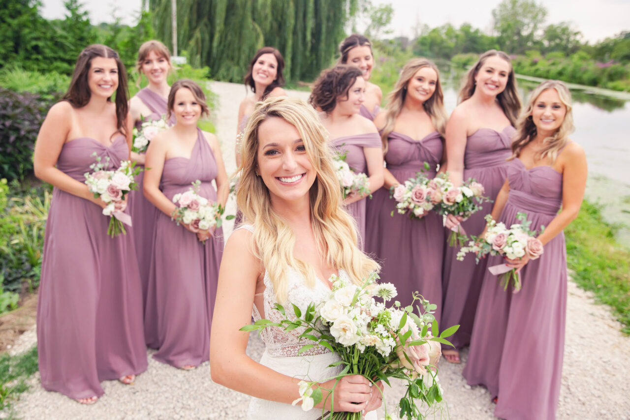 Bride with her Bridesmaids behind her for formal wedding photos
